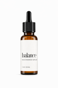 Brown serum bottle with dropper labeled 'balance' on a white background